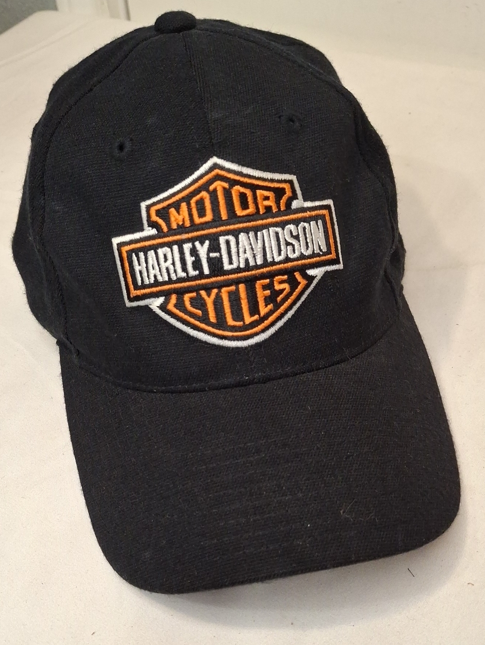 Harley-Davidson Black Cap with Orange and White Patch. Fitted.